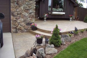 Seamless stone entry, walk to driveway Mackell Home, 4269 Carter Tr.